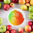 XQS - Φακελάκια Νικοτίνης Twin Apple Strong 8mg, κουτί στρογγυλό καφέ-πράσινο, μήλα